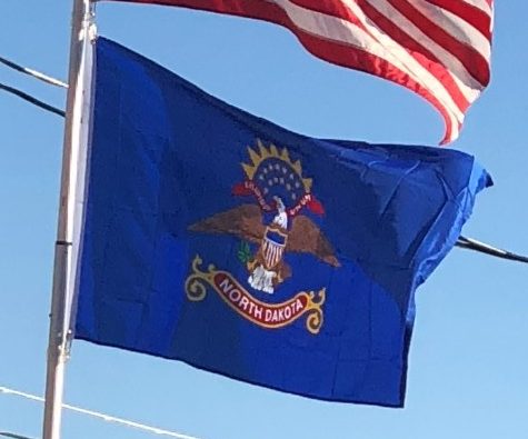 US and North Dakota Flags on Our Flagpole